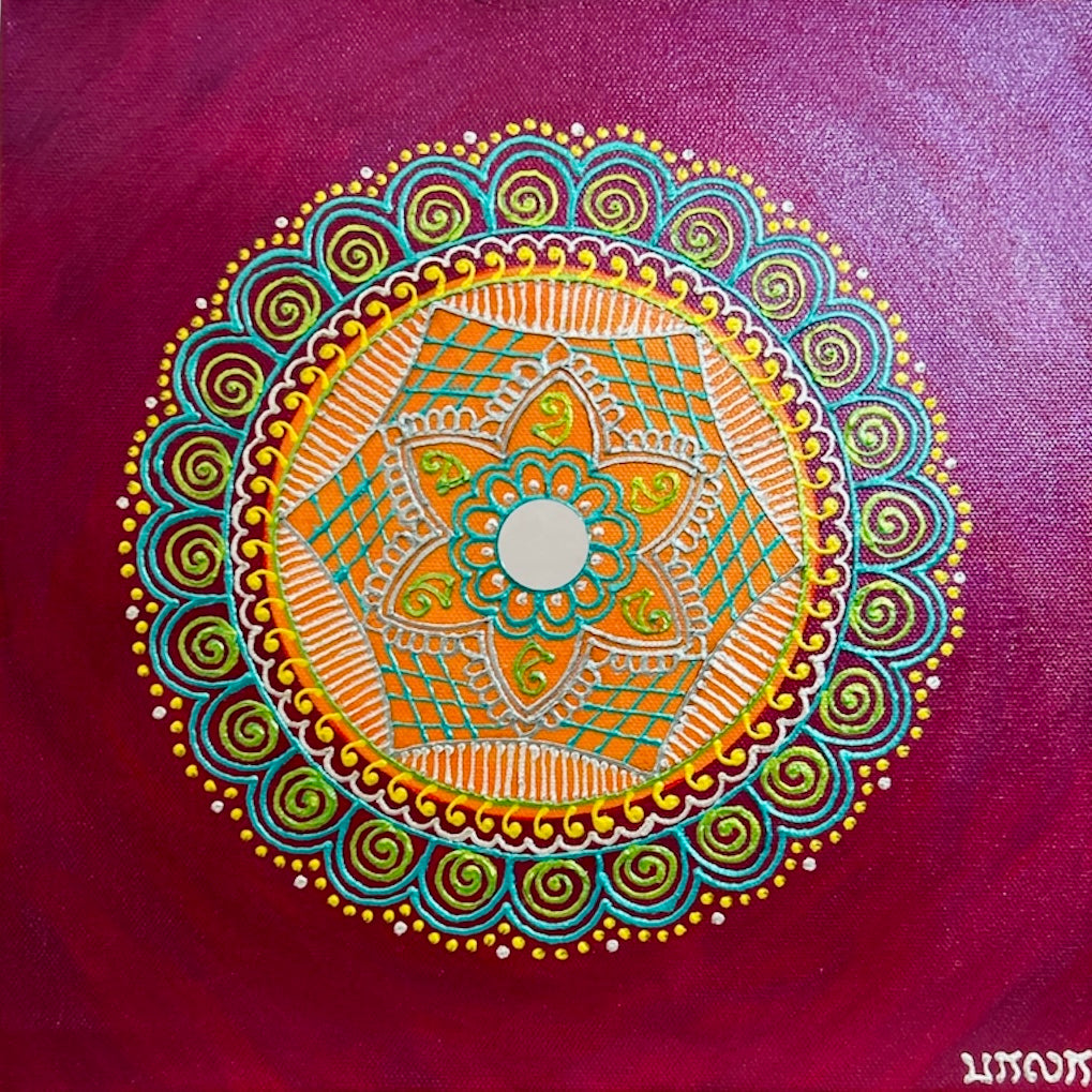 Colorful mandala design on a purple background