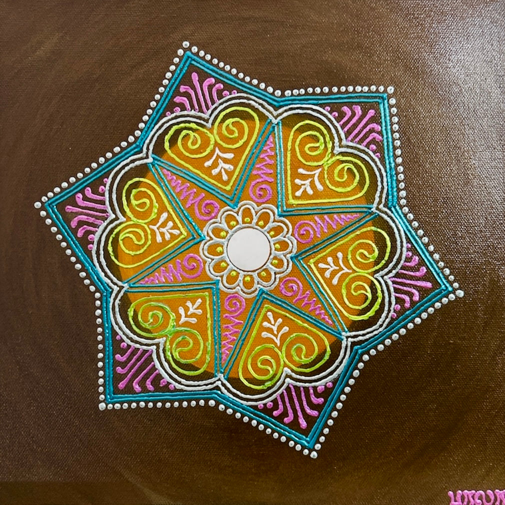 Colorful mandala design on a brown background
