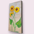 yellow sunflowers with green leaves on brown background textured floral painting by Bala Thiagarajan, hand-piped acrylic on wood panel with iridescent sculptural detail